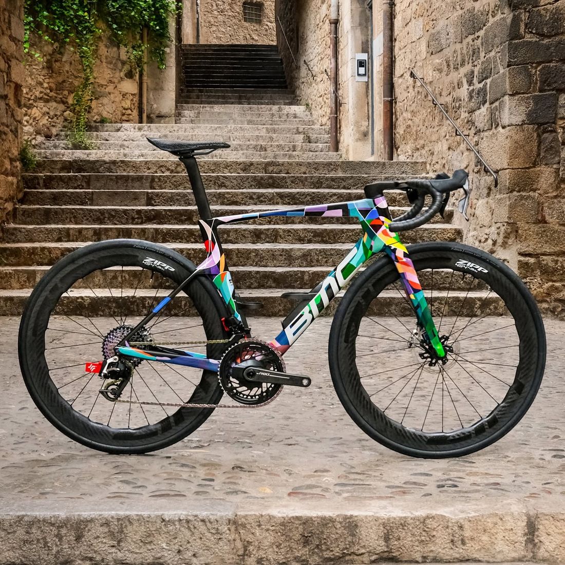 A bespoke-painted road bike on the medieval steps of Girona's old town