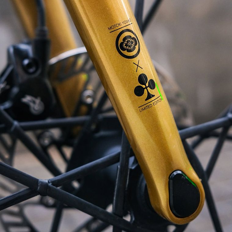 A limited-edition artist collaboration marked on a gold fork