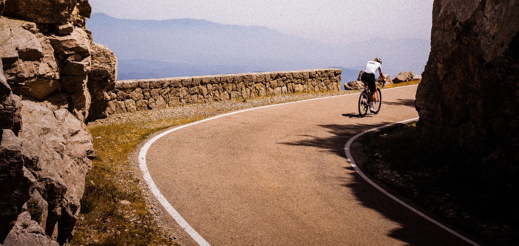A rider on the rock-cut climb above Girona, Catalonia